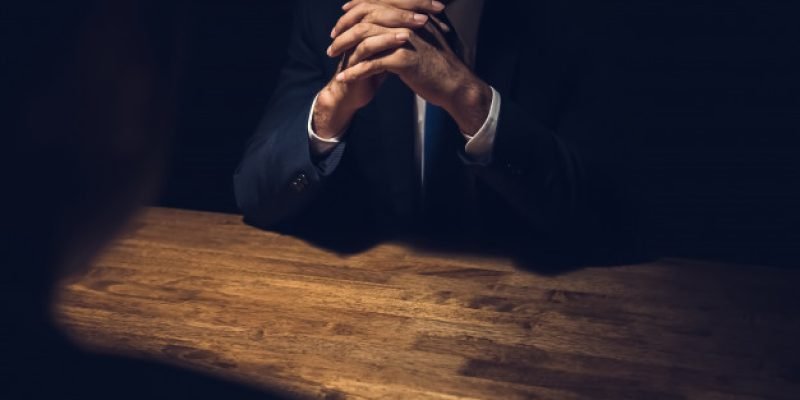 detective-interviewing-suspect-dark-private-room_8087-3145